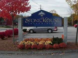 Stone House Condominiums welcome sign in Milford, New Hampshire